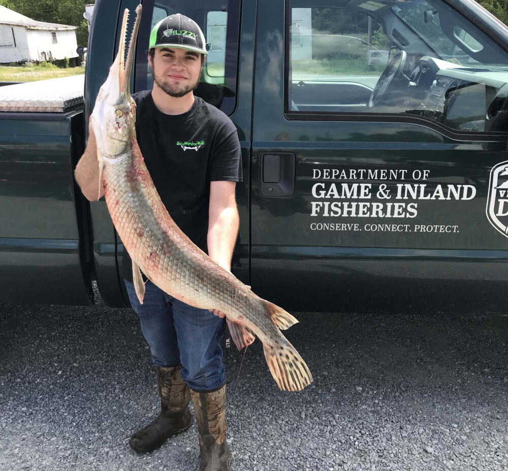 An image of Deal and the large gar he caught