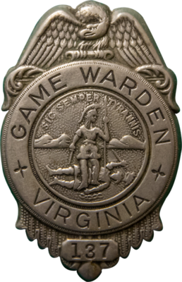 An image of an old game warden badge with the stamp of Virginia on the front and an eagle at the top