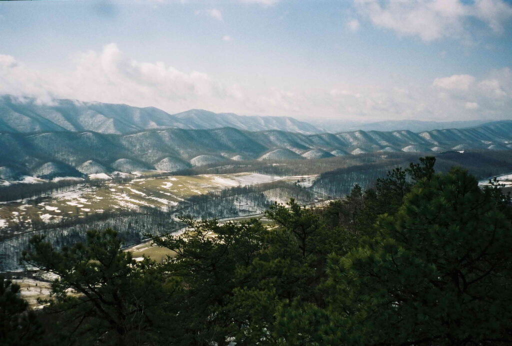 An image of a mountain range taken from the top of a mountain