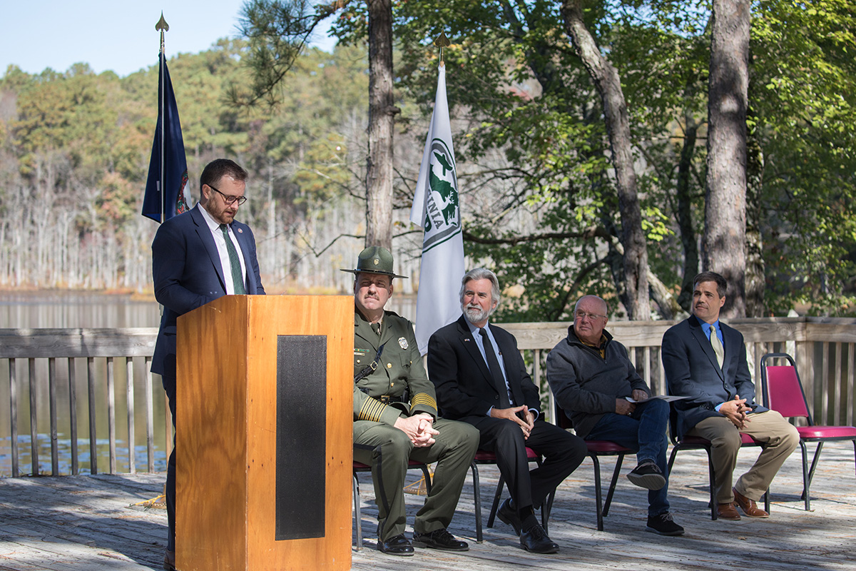 An image of Acting Virginia Secretary of Natural Resources, Travis Voyles, speaking at the ceremony.