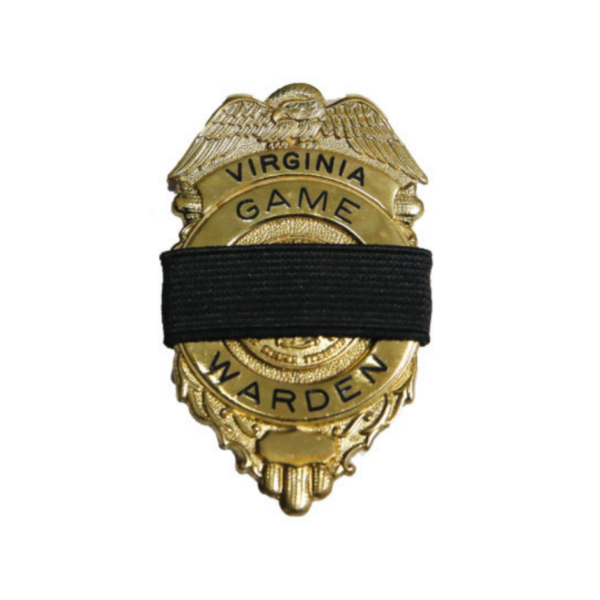 A gold Virginia game warden badge.