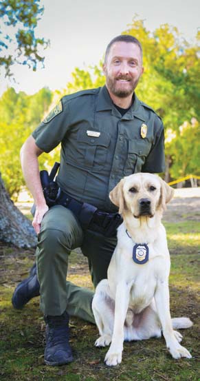 A photo of the K9 and CPO handler