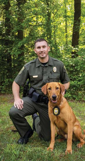 A photo of the K9 and CPO handler