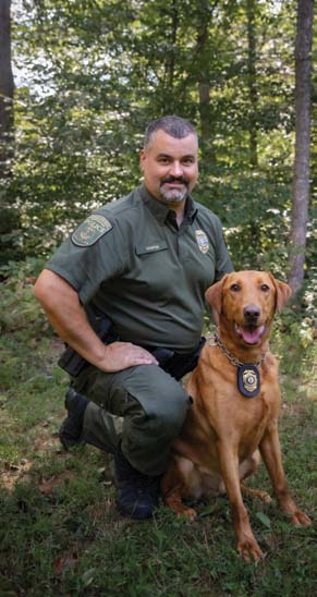 A photo of the K9 and CPO handler