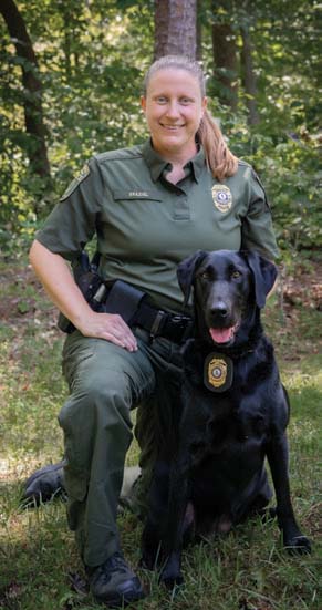 A photo of the K9 and CPO handler