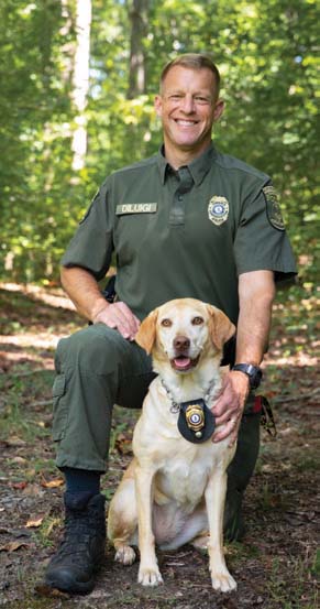 A photo of the K9 and CPO handler