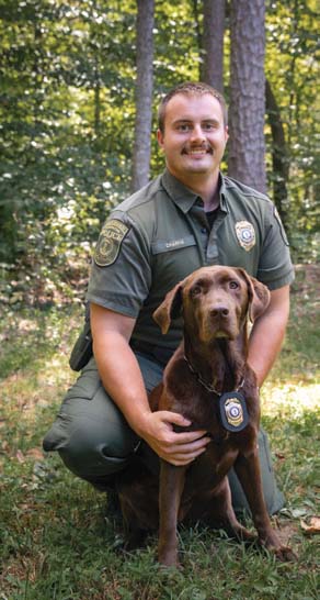 A photo of the K9 and CPO handler