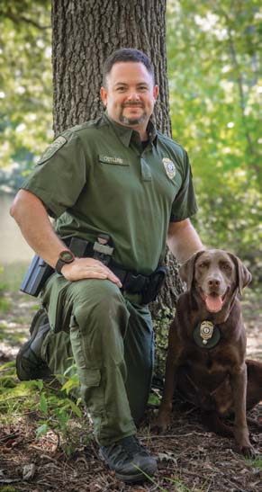 A photo of the K9 and CPO handler