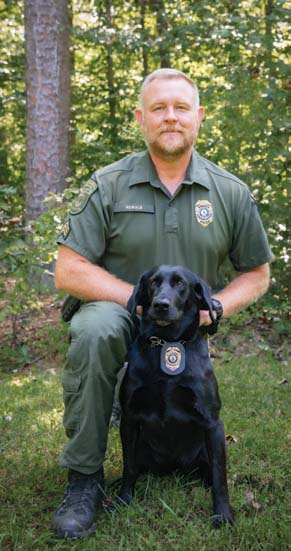 A photo of the K9 and CPO handler