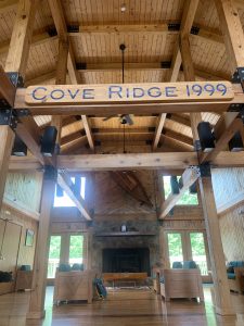 An image of a wooden building with the words "Cove ridge 1999" on a plaque in it's rafters