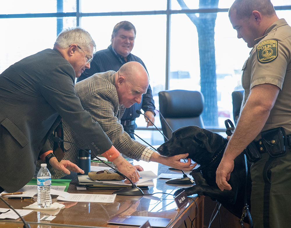 K9 Justice and CPO Wayne Billhimer (right) greeting DGIF Board members Tom Sadler (center) and Gary Martel at Justice's retirement ceremony.
