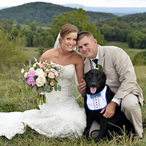 K9 Justice with CPO Wayne Billhimer and his wife, Molly, at their wedding, where Justice was the ring-bearer.