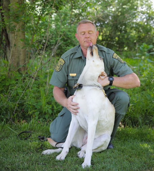 K9 scout licking officer Richard Howald