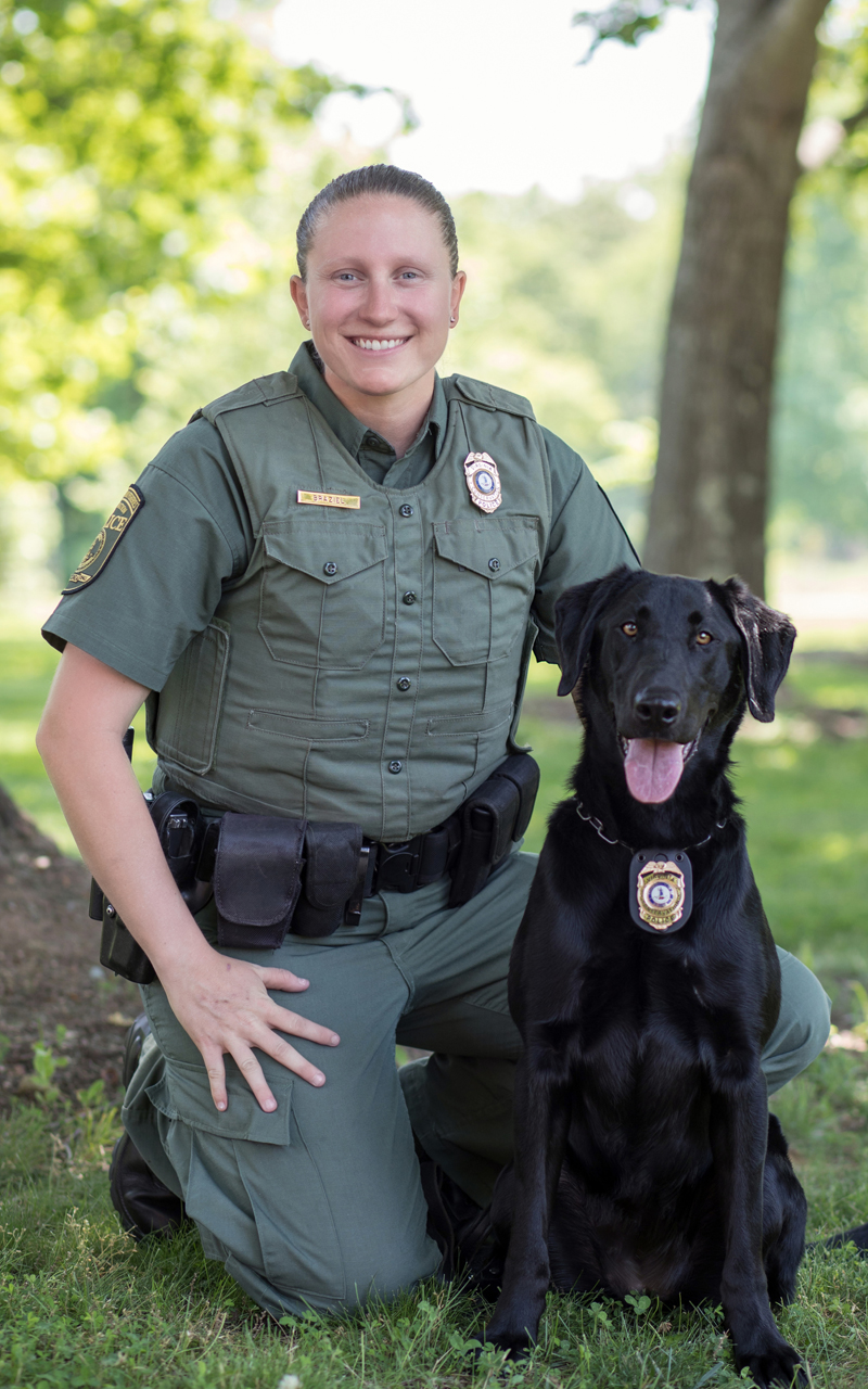 An image of Bonnie Braziel and her K9 officer a black lab named Grace