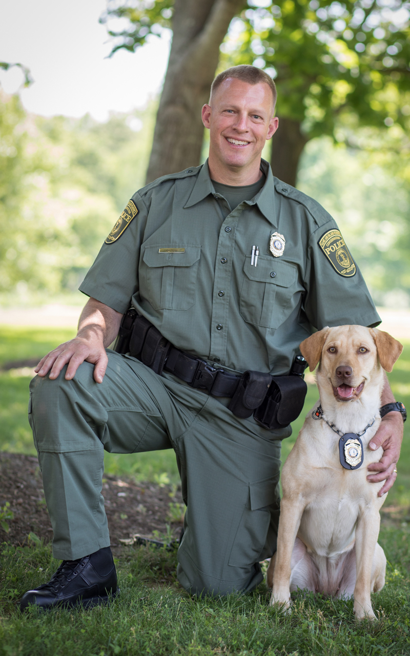 An image of Mark DiLuigi and his K9 officer a yellow Lab named Lily