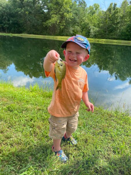Dawson (age 2), holding a fish