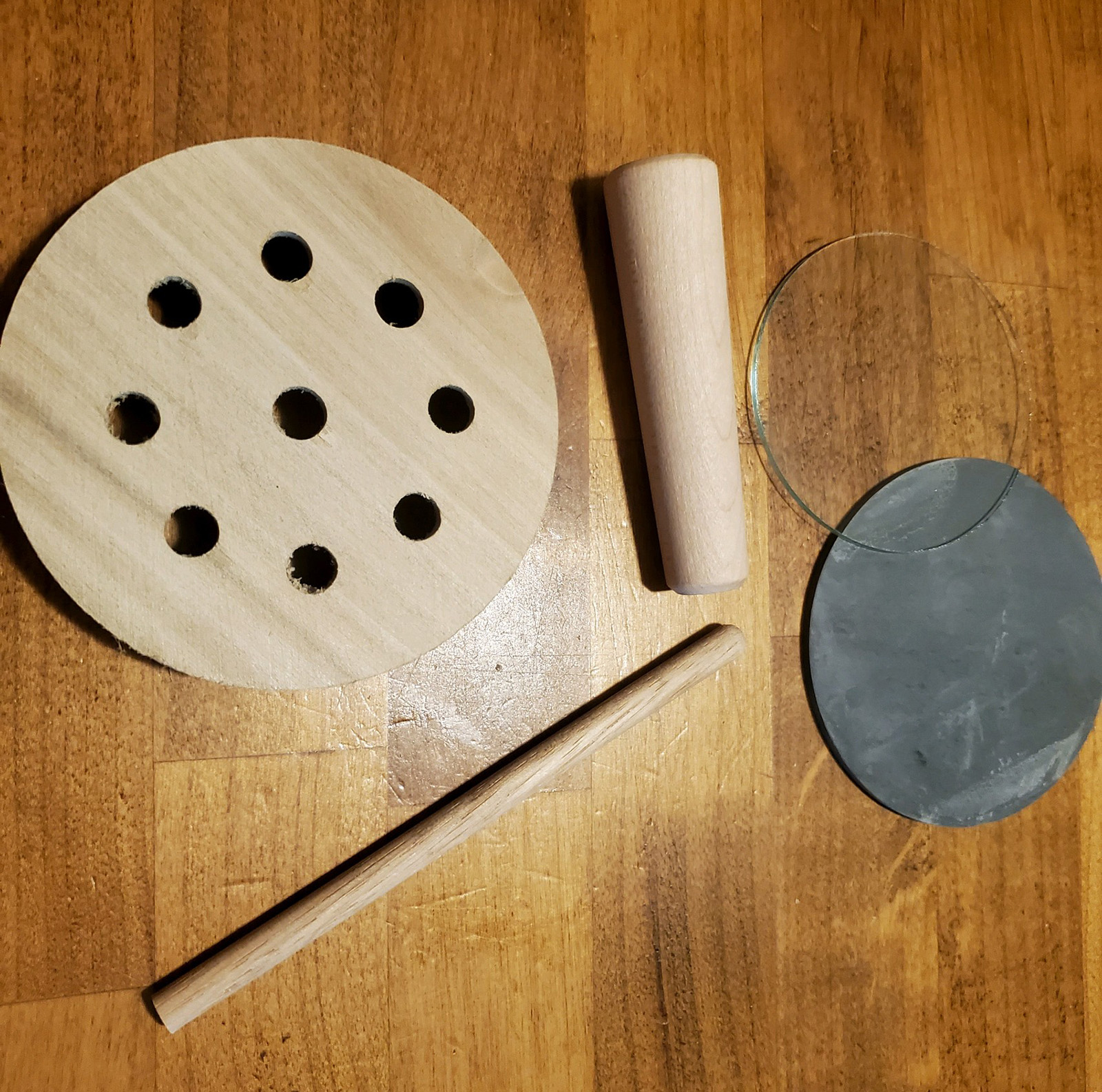 A photo of the parts involved in assembling a turkey call.