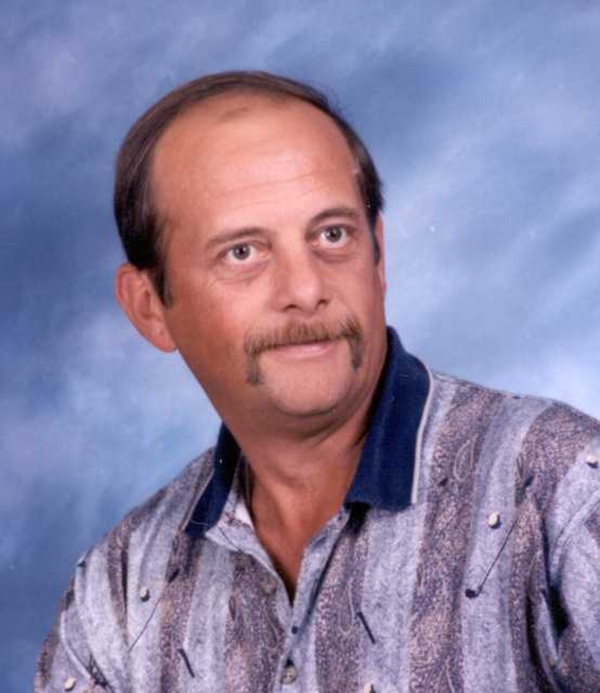A headshot of a man with a mustache.