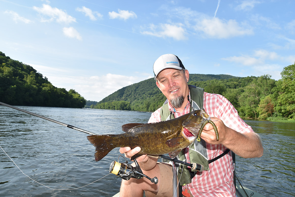 Britt Stoudenmire with a 17 ½-inch smallmouth he caught on the New this July.