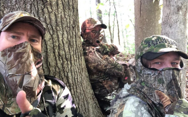 Three people hunting for turkeys during the One Shot fundraiser