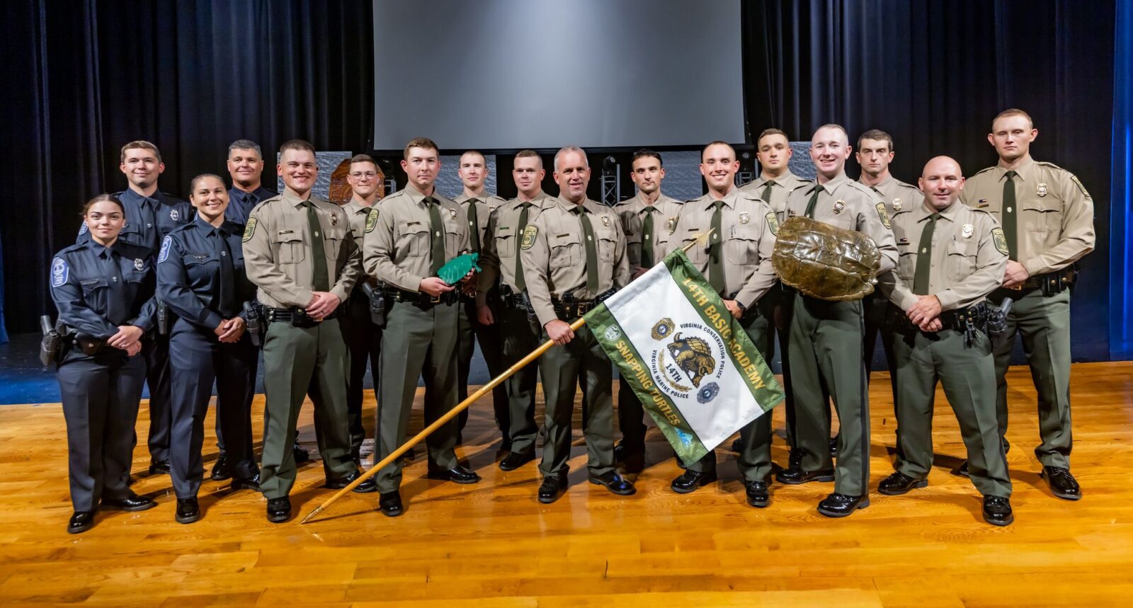 Group photo of the 14th Natural Resources Basic Academy graduates