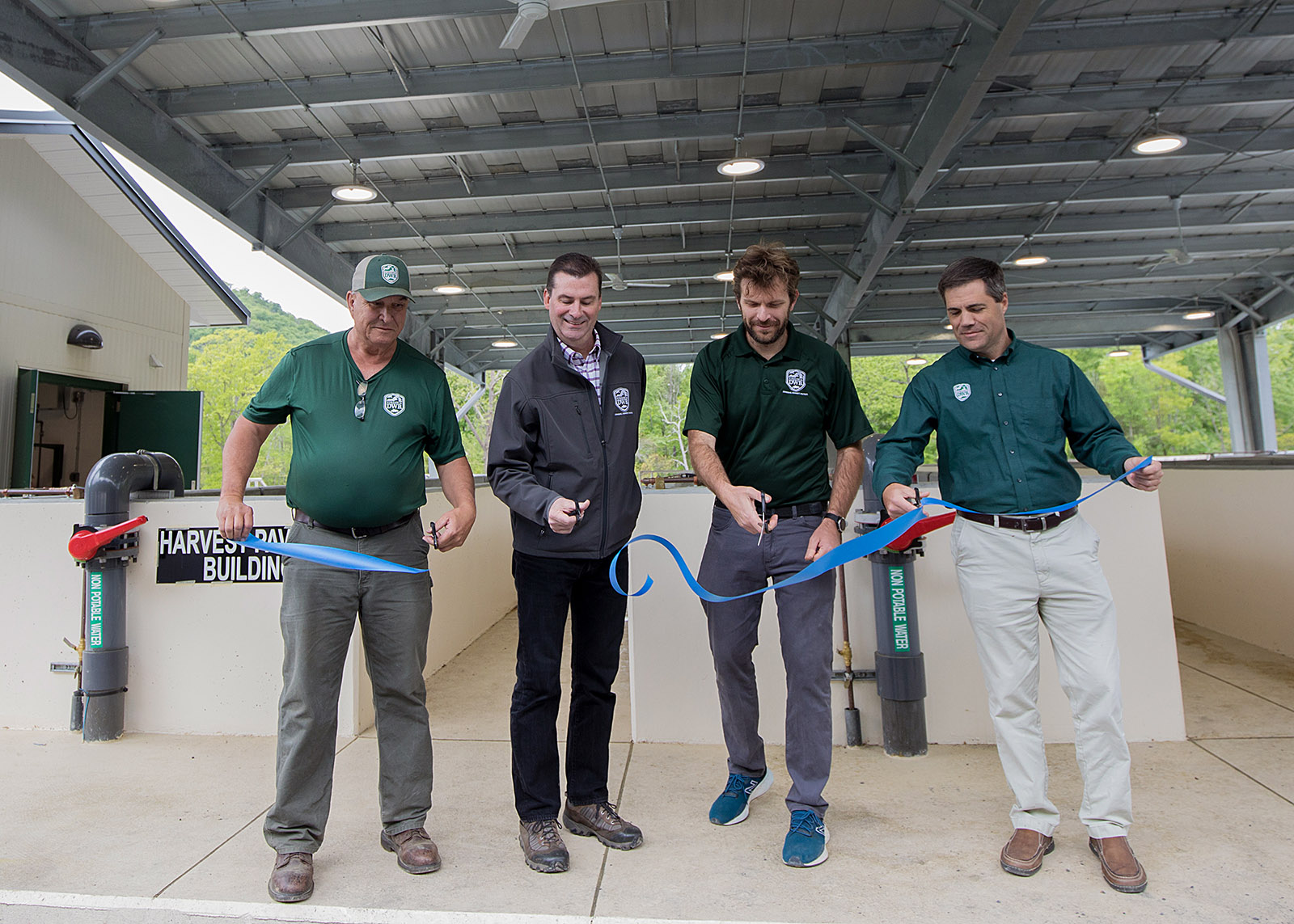Left to right: DWR Hatchery Manager Wayne Pence, DWR Hatchery Superintendent Brendan Delbos, DWR Chief of Fisheries Dr. Michael Bednarski, and DWR Executive Director Ryan Brown cut the ribbon for the May opening of the updated Front Royal Fish Cultural Station.
