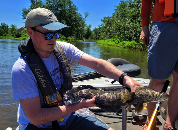 A Virginia angler shows a Northern Snakehead caught while fishing.