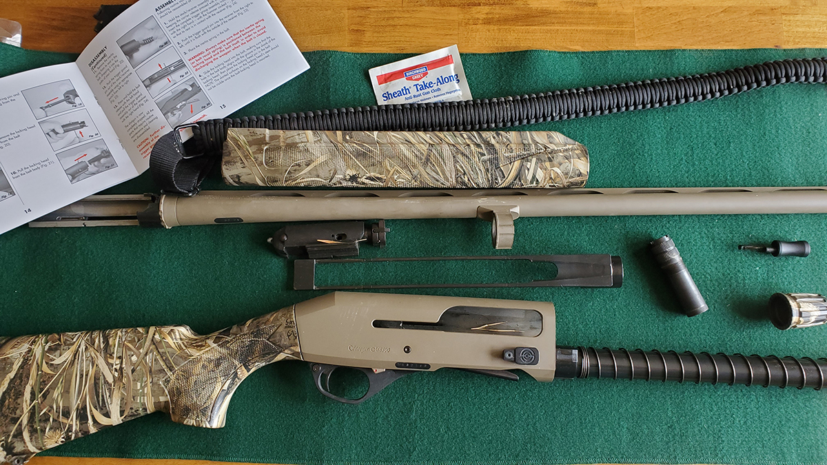 An image of two camouflage hunting guns