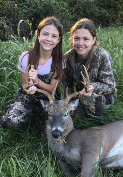 An image of two girls and a deer Morgan has shot and killed