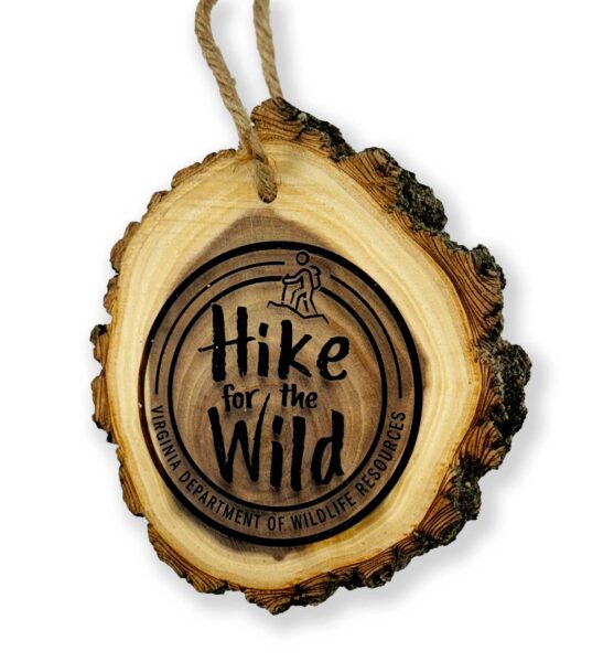 An example image of the Hike for the Wild finisher medal which is made out of wood.