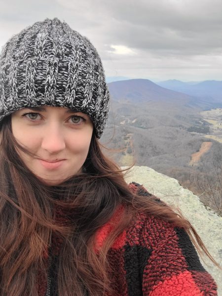 Meg with mountains visible in the background